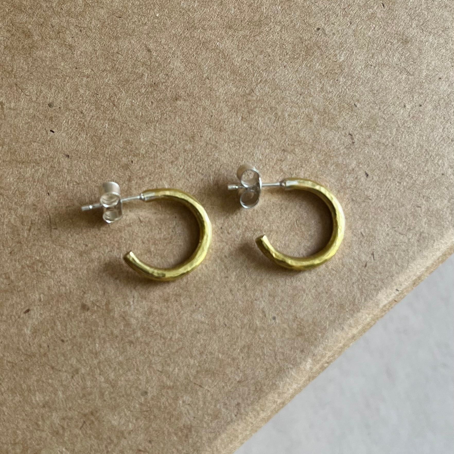 Close up of brass hammered hoop studs on Kraft gift box