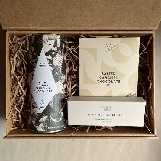 Thinking of you gift box containing drinking chocolate, salted caramel chocolate bar and scented tea lights