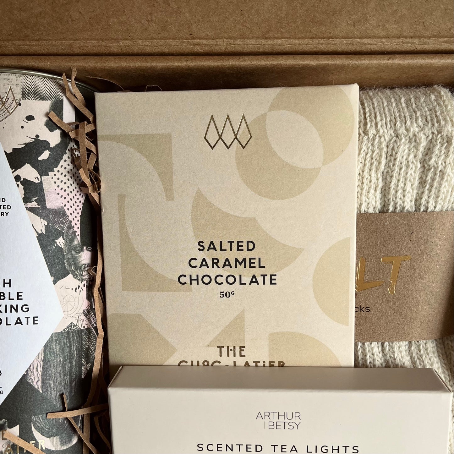 Close up image of salted caramel chocolate bar included in A Hug in a Box luxury gift box.