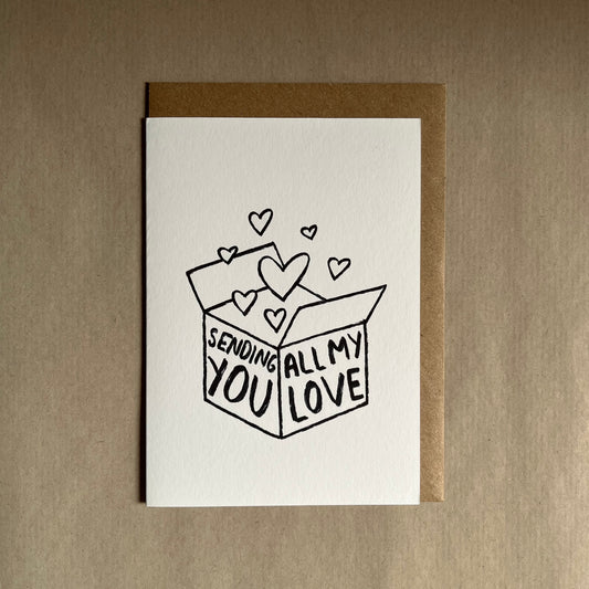 Sending all my love greeting card with a box of hearts and text 'Sending all my love' 