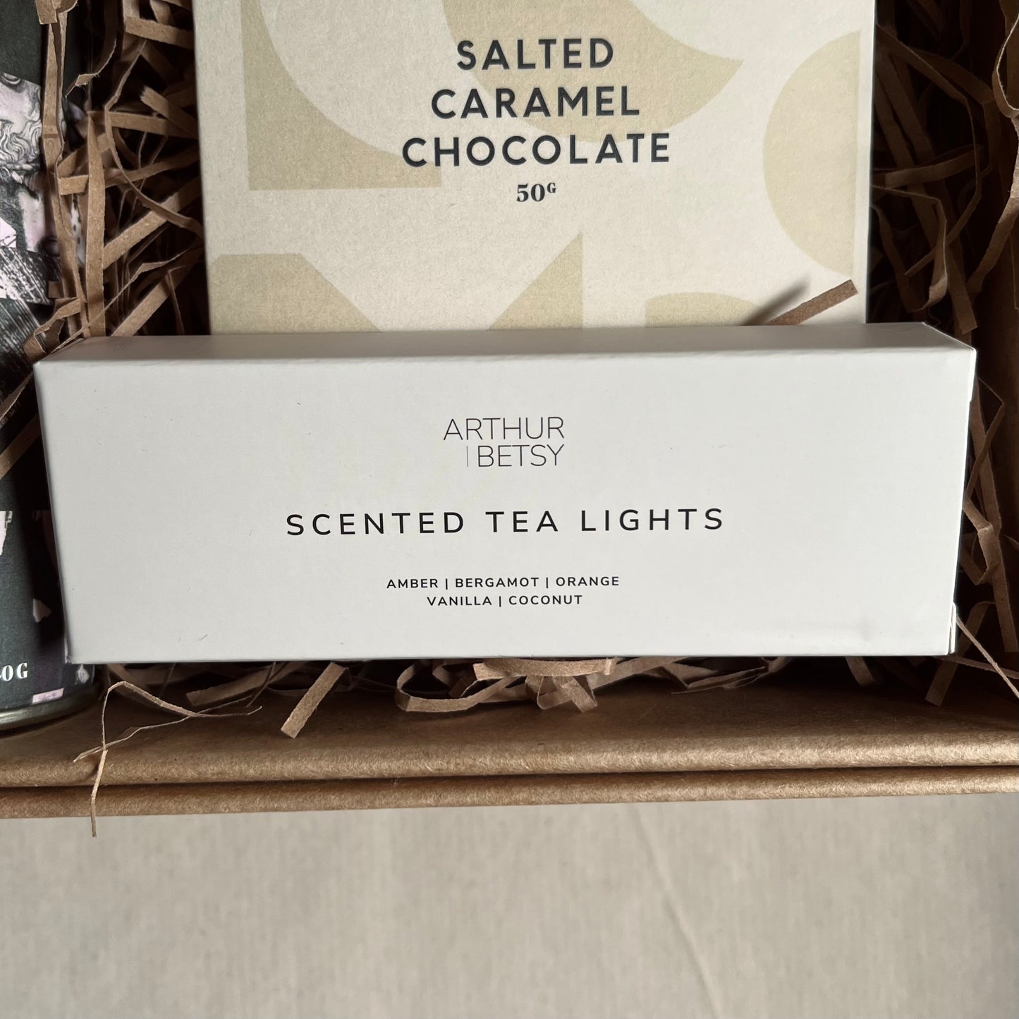 Close up image of pack of three scented tea lights included in The Comfort Edit Thinking of You Gift Box